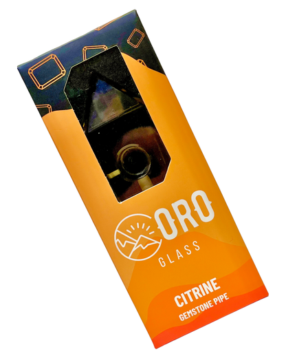 A Citrine Oro Gemstone Pipe in its packaging.